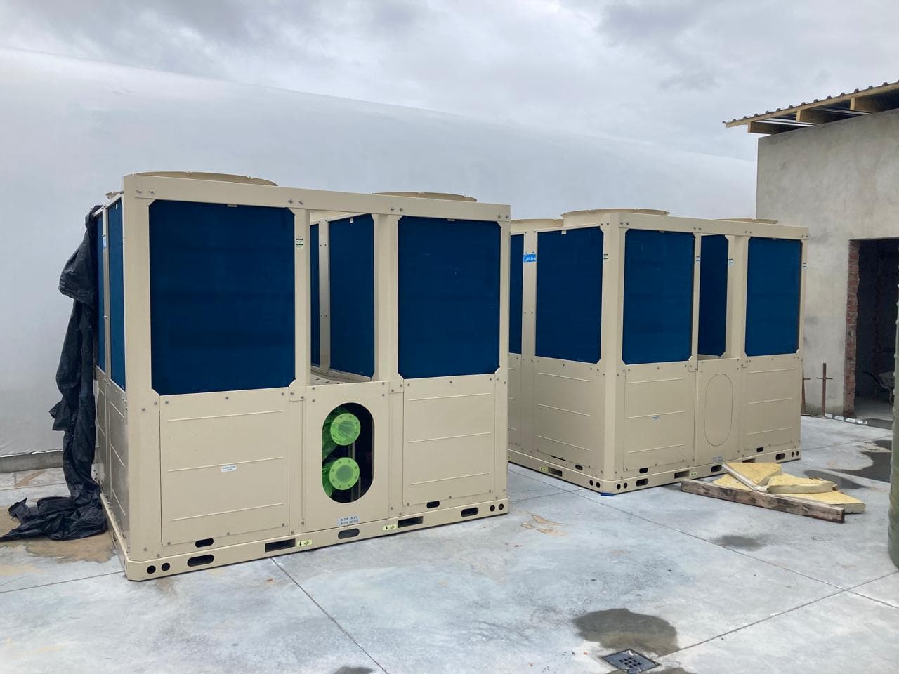 Commercial chillers installed on a concrete pad